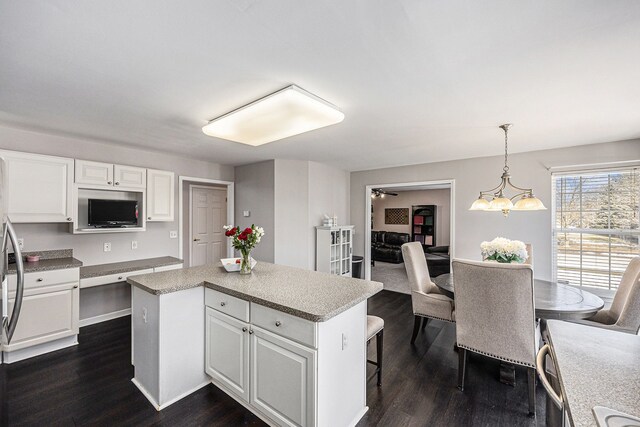 54354 Bryce Canyon Trl, Macomb, MI 48042 - kitchen with dark wood finished floors, a center island, and white cabinetry