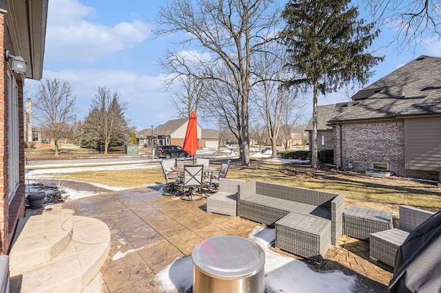 view of patio / terrace featuring outdoor dining area, a residential view, and an outdoor hangout area