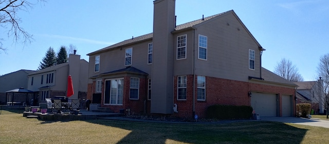 54354 Bryce Canyon Trl, Macomb, MI 48042 - view of side of property with a chimney, brick siding, concrete driveway, and a lawn