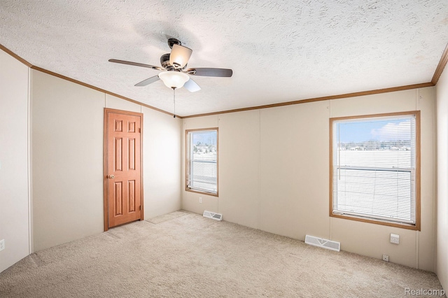 5128 Twin Lakes Dr, Kimball, MI 48074 - carpeted spare room with crown molding, a textured ceiling, a ceiling fan, and vaulted ceiling