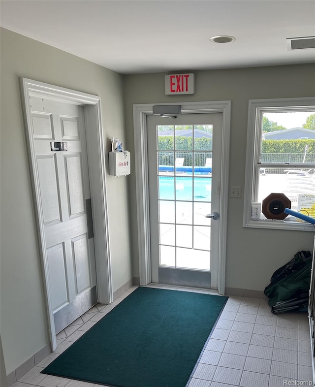 5128 Twin Lakes Dr, Kimball, MI 48074 - doorway with tile patterned floors and baseboards