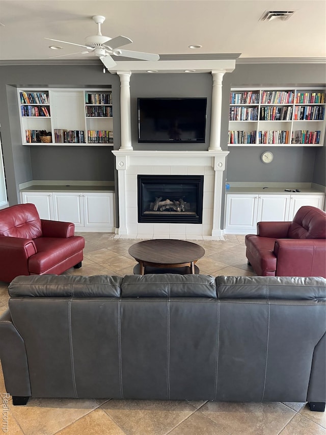 5128 Twin Lakes Dr, Kimball, MI 48074 - living area featuring a ceiling fan, built in shelves, a tiled fireplace, and recessed lighting