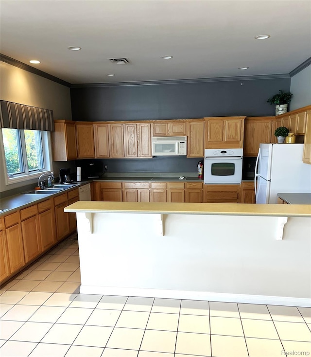 5128 Twin Lakes Dr, Kimball, MI 48074 - kitchen featuring white appliances, a kitchen bar, ornamental molding, and light tile patterned floors
