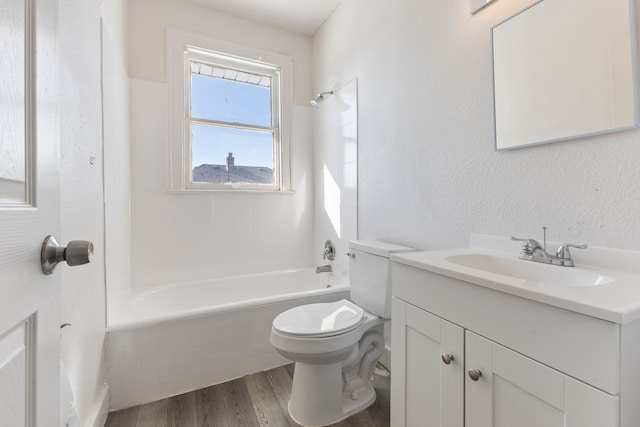 full bathroom with vanity, wood-type flooring, bathtub / shower combination, and toilet