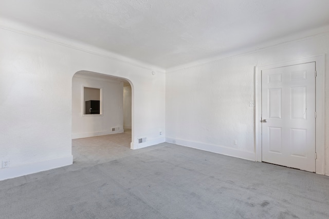 empty room featuring light colored carpet