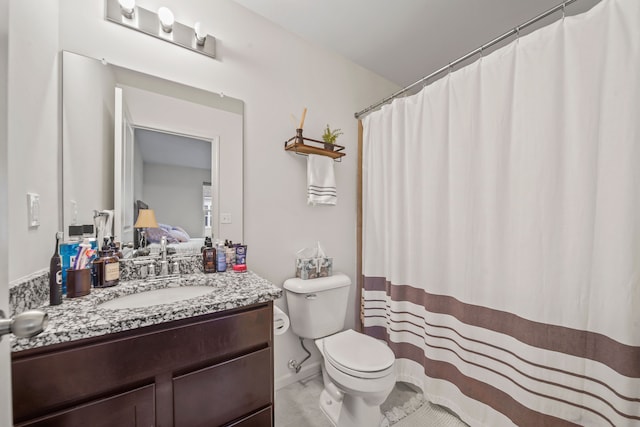 bathroom with vanity and toilet