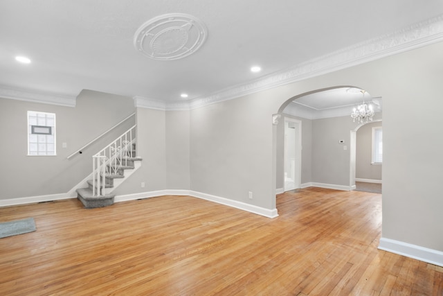 unfurnished room with crown molding and light hardwood / wood-style flooring