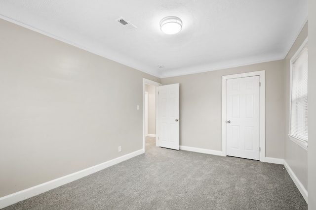 unfurnished bedroom with carpet