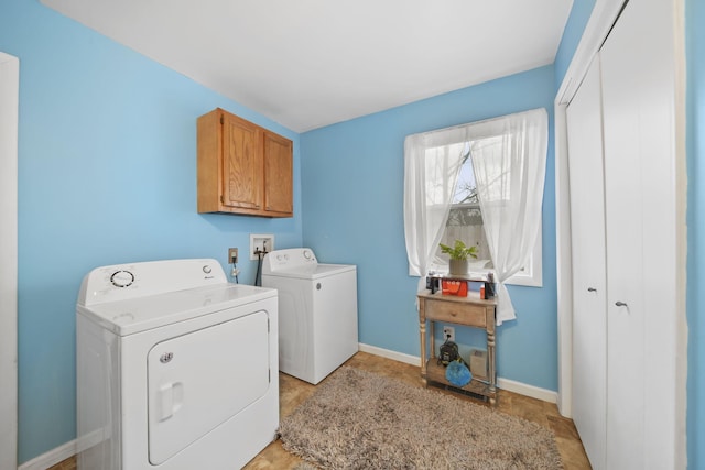 washroom with cabinets and separate washer and dryer