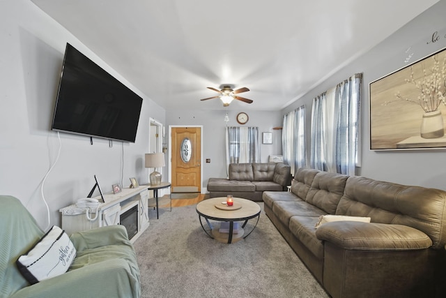 living room featuring hardwood / wood-style floors and ceiling fan