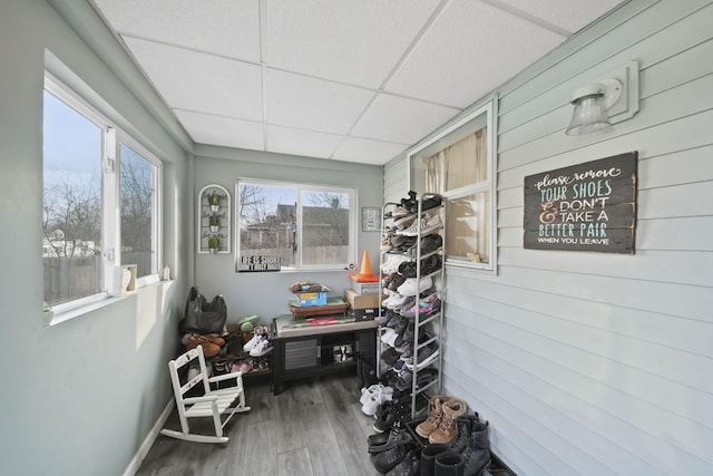 sunroom / solarium featuring a paneled ceiling