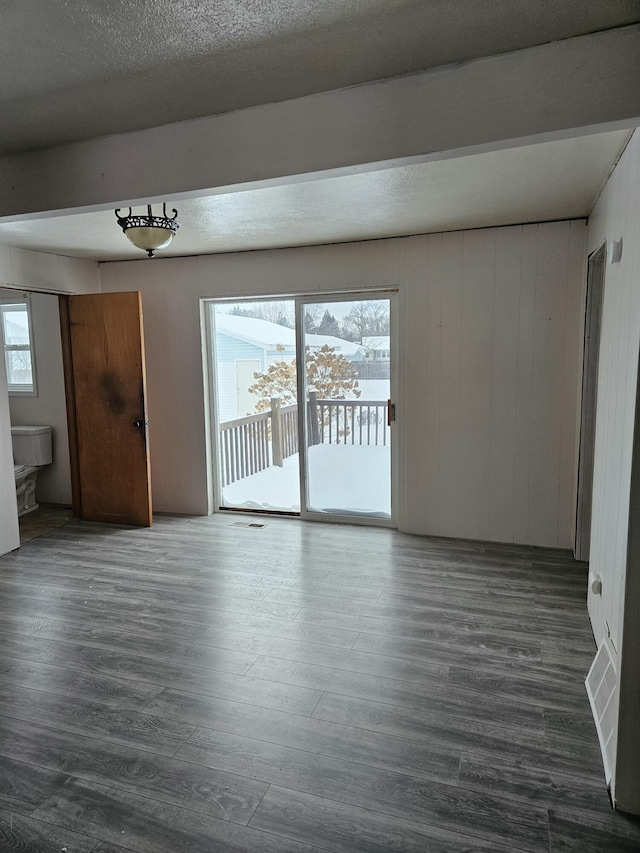 445 Colfax St, Cadillac, MI 49601 - unfurnished living room with wood finished floors