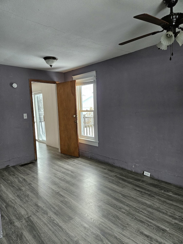 445 Colfax St, Cadillac, MI 49601 - spare room with wood finished floors and ceiling fan