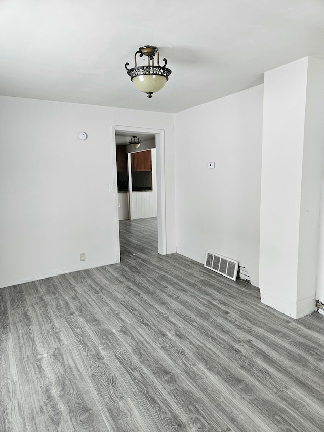 445 Colfax St, Cadillac, MI 49601 - empty room featuring wood finished floors