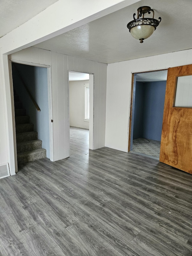 445 Colfax St, Cadillac, MI 49601 - below grade area with wood finished floors and stairway