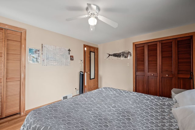 bedroom featuring hardwood / wood-style flooring and ceiling fan