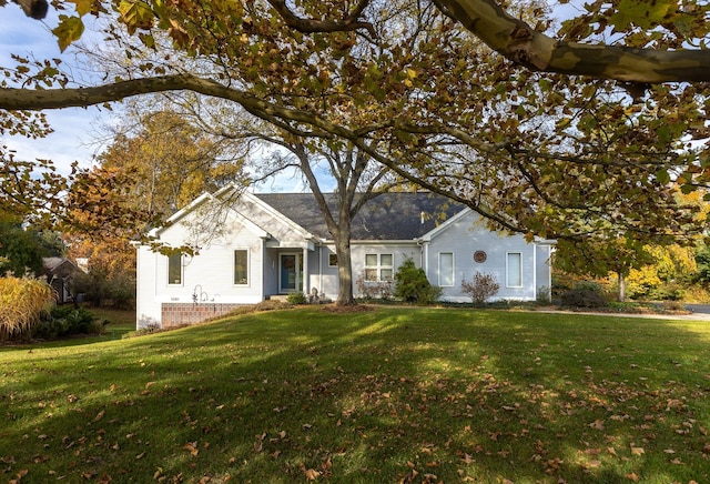 ranch-style home with a front lawn