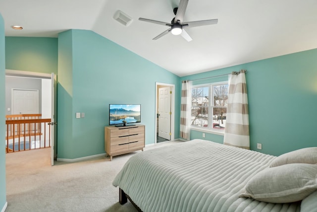 bedroom featuring light colored carpet, visible vents, vaulted ceiling, and baseboards