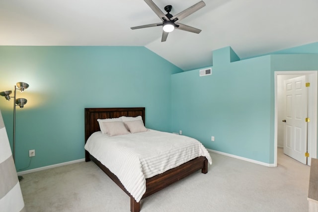 bedroom with visible vents, vaulted ceiling, light carpet, and baseboards