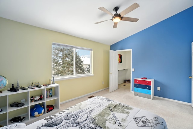 bedroom featuring vaulted ceiling, baseboards, visible vents, and light colored carpet