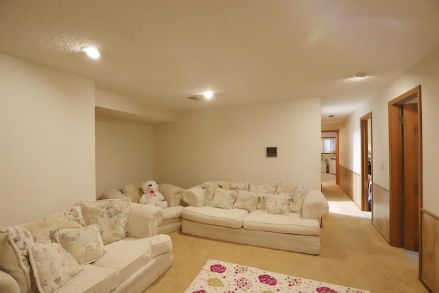 living area with light colored carpet