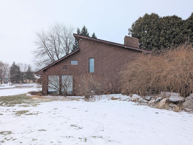 view of snow covered property