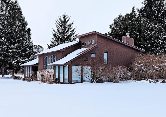 exterior space featuring a chimney