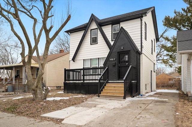 view of front facade with a porch and brick siding