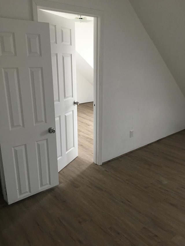 additional living space with dark hardwood / wood-style floors