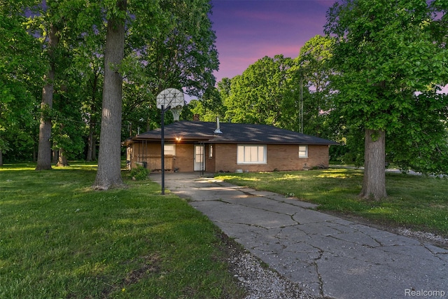 1408 Stephens Ave, Flint, MI 48507 - single story home with a front lawn, brick siding, and driveway