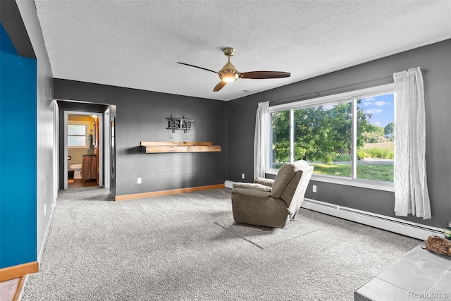 1408 Stephens Ave, Flint, MI 48507 - sitting room with a baseboard heating unit, carpet, ceiling fan, and a textured ceiling