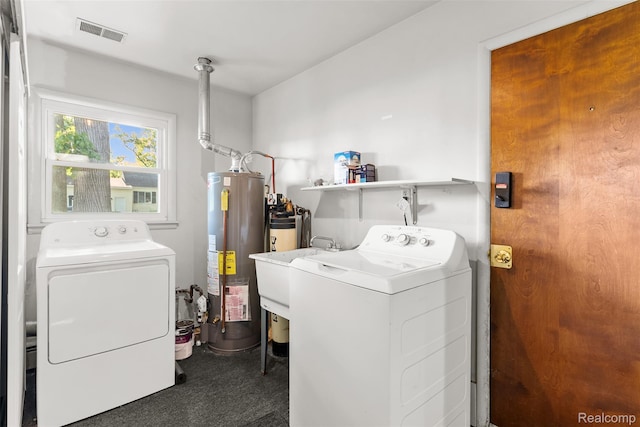 1408 Stephens Ave, Flint, MI 48507 - washroom with gas water heater and separate washer and dryer