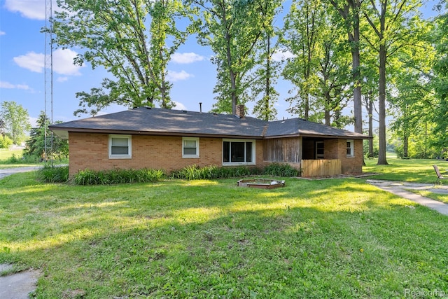 1408 Stephens Ave, Flint, MI 48507 - view of front facade featuring brick siding and a front lawn