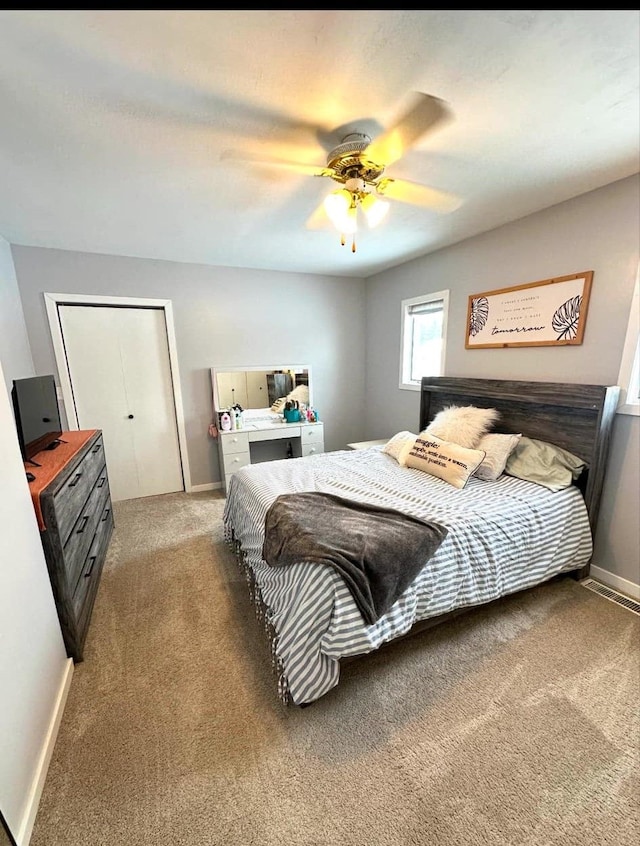 carpeted bedroom with ceiling fan