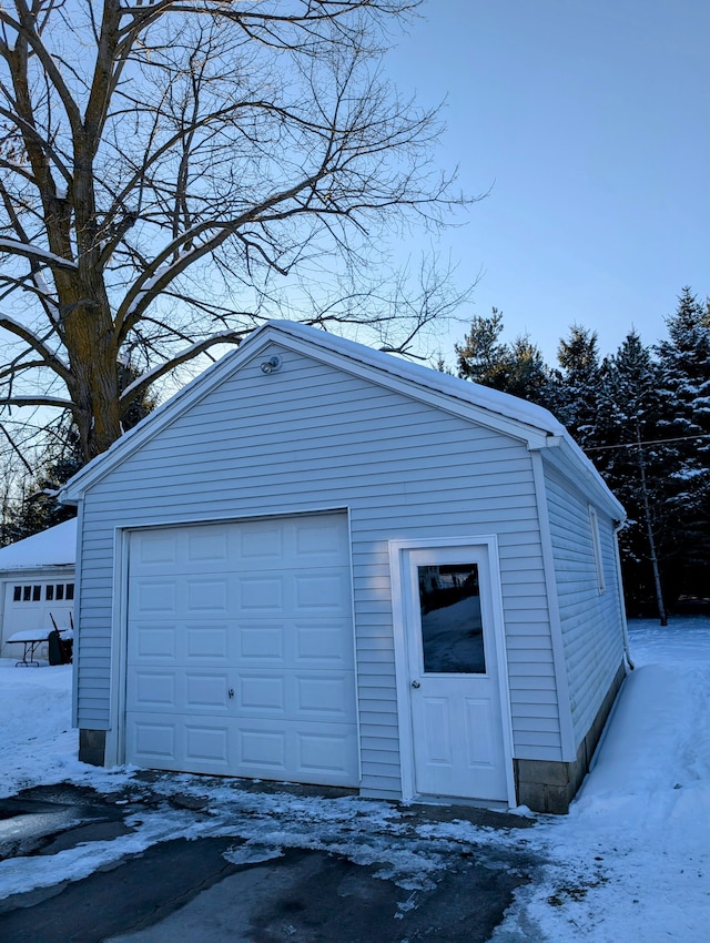 view of snow covered garage