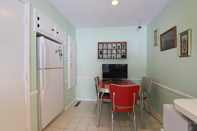 dining room featuring light tile patterned flooring