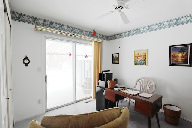 office space with ceiling fan and carpet