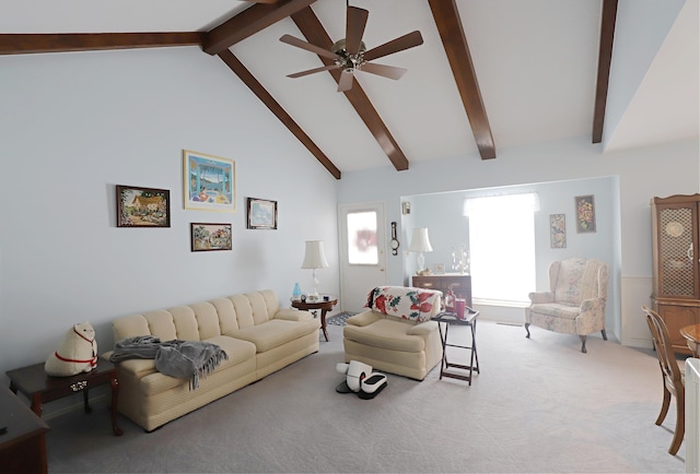 carpeted living room with beamed ceiling, ceiling fan, and high vaulted ceiling