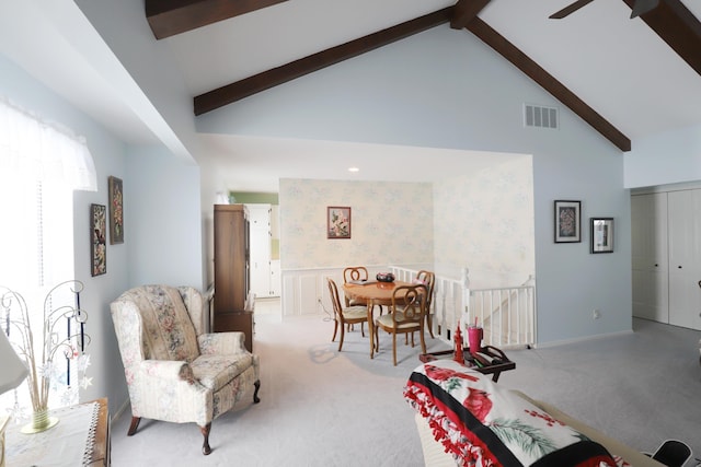 interior space featuring beam ceiling and high vaulted ceiling