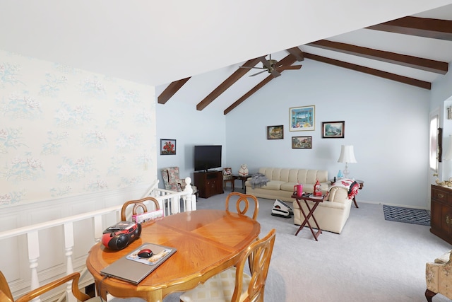 carpeted dining area with lofted ceiling with beams and ceiling fan