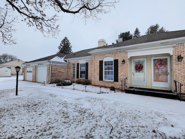 single story home featuring a garage