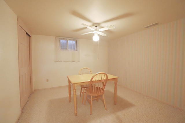 dining room with light colored carpet