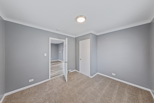 unfurnished bedroom featuring carpet