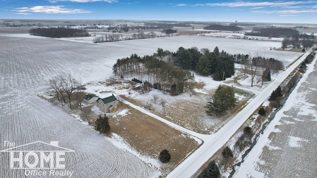 snowy aerial view with a rural view