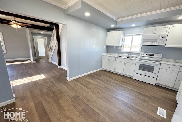 kitchen with white cabinetry, white appliances, dark hardwood / wood-style floors, and sink