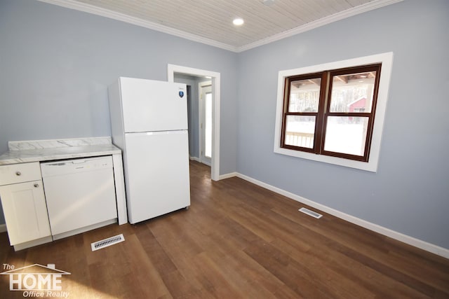 kitchen with dark wood-type flooring, ornamental molding, white appliances, light stone countertops, and white cabinets