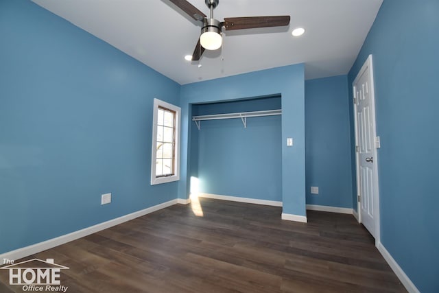 unfurnished bedroom with dark hardwood / wood-style floors, ceiling fan, and a closet