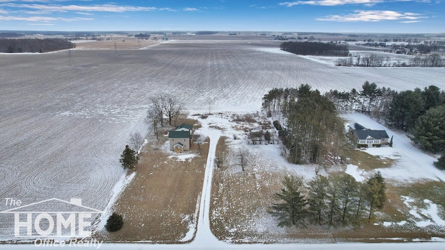 snowy aerial view featuring a rural view