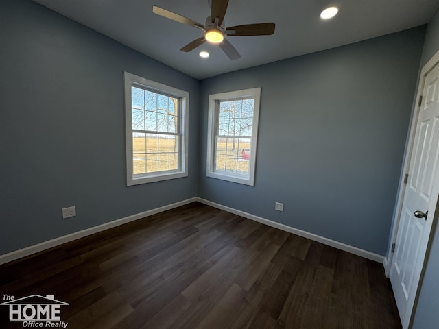 unfurnished room featuring ceiling fan and dark hardwood / wood-style floors