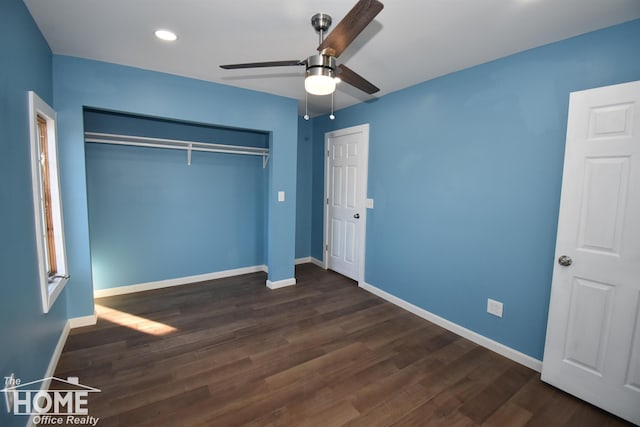 unfurnished bedroom with ceiling fan, dark hardwood / wood-style floors, and a closet